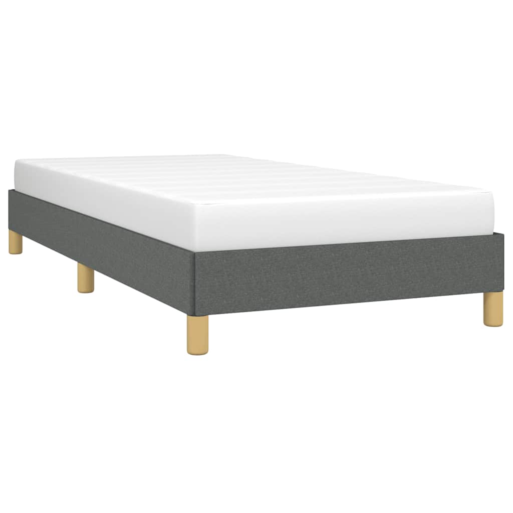 Grey upholstered twin bed frame with wooden legs