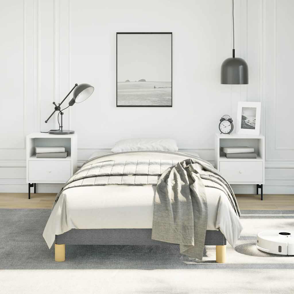 Modern white bedside table with drawer and shelf