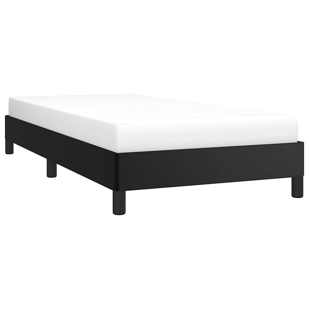 Black upholstered twin bed frame with white mattress