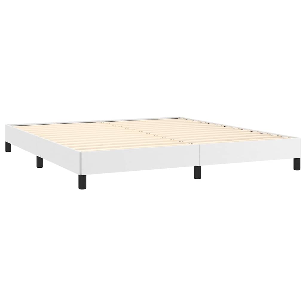 Modern white platform bed frame with grey bedding