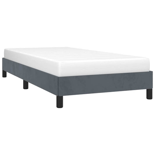 Gray upholstered twin bed frame with white mattress