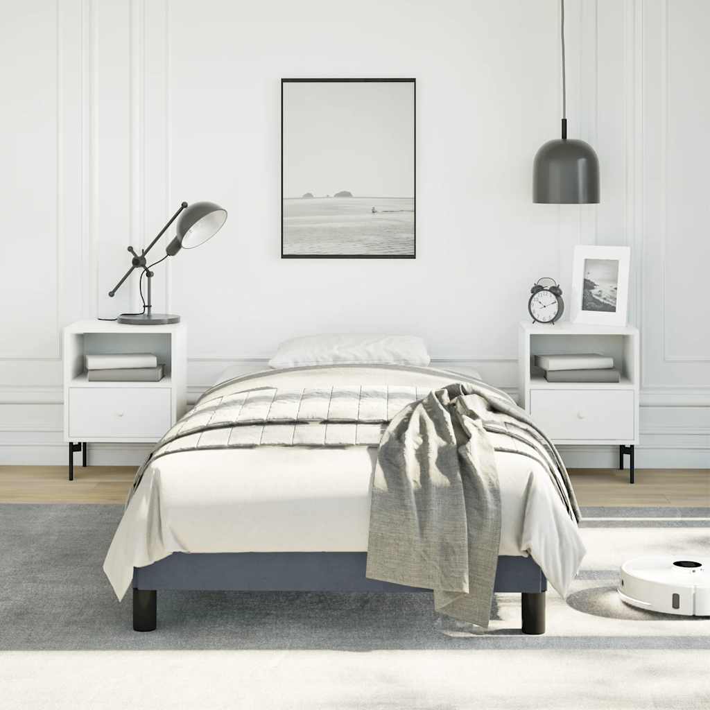 Grey upholstered twin bed frame with wooden slats