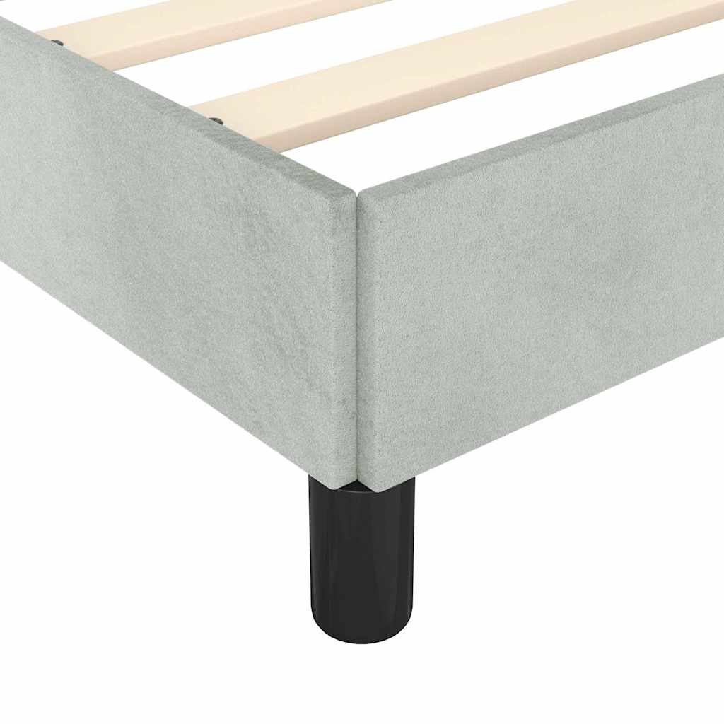 Modern light grey upholstered bed frame with wooden slats and black legs