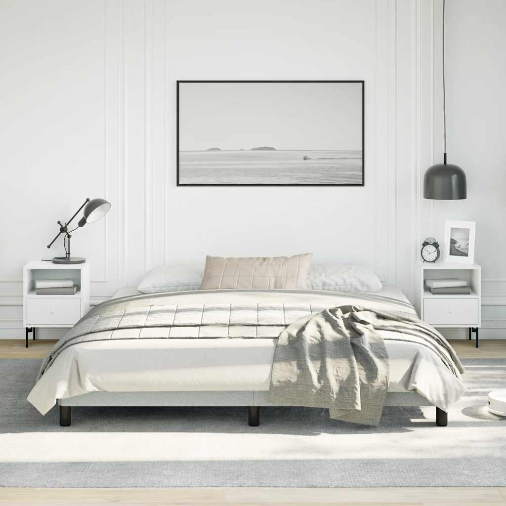 Light grey upholstered bed frame with wooden slats and black legs