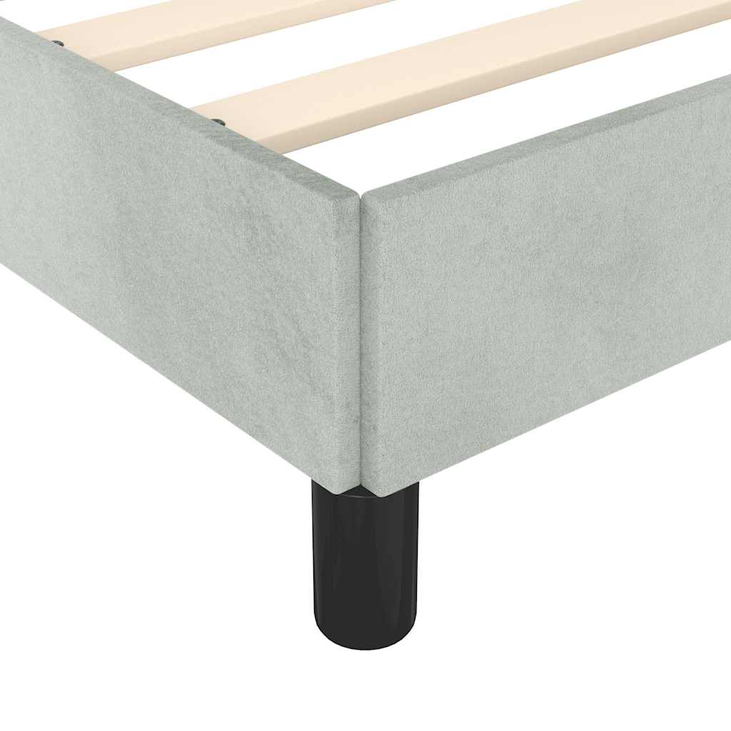 Light gray upholstered platform bed frame with wooden slats and black legs