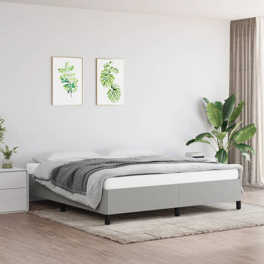 Grey upholstered king size bed frame with minimalist design