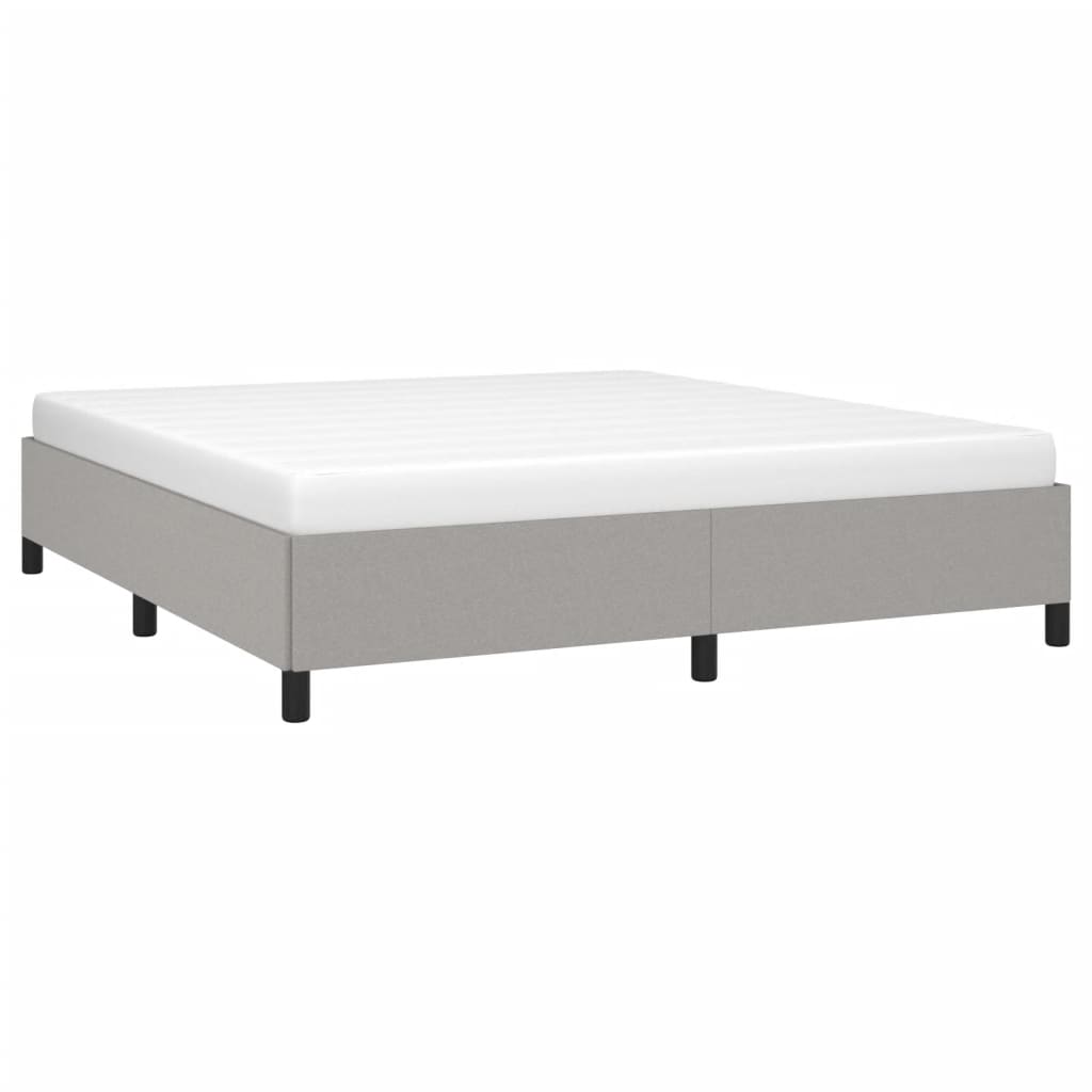 Modern grey fabric divan bed base with a white mattress