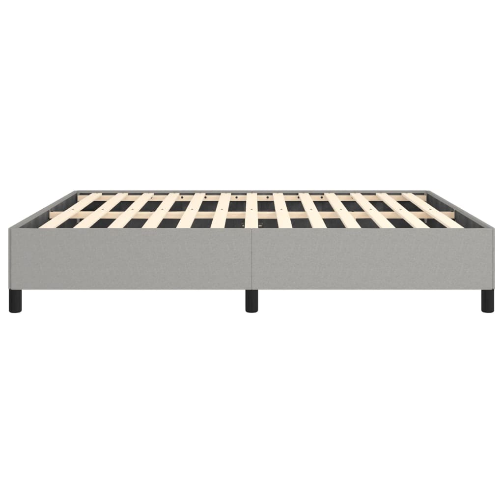 Low profile grey upholstered bed frame with wooden slats