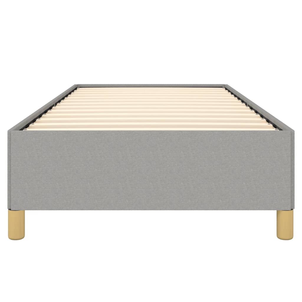 Single bed frame with grey fabric upholstery and a white mattress