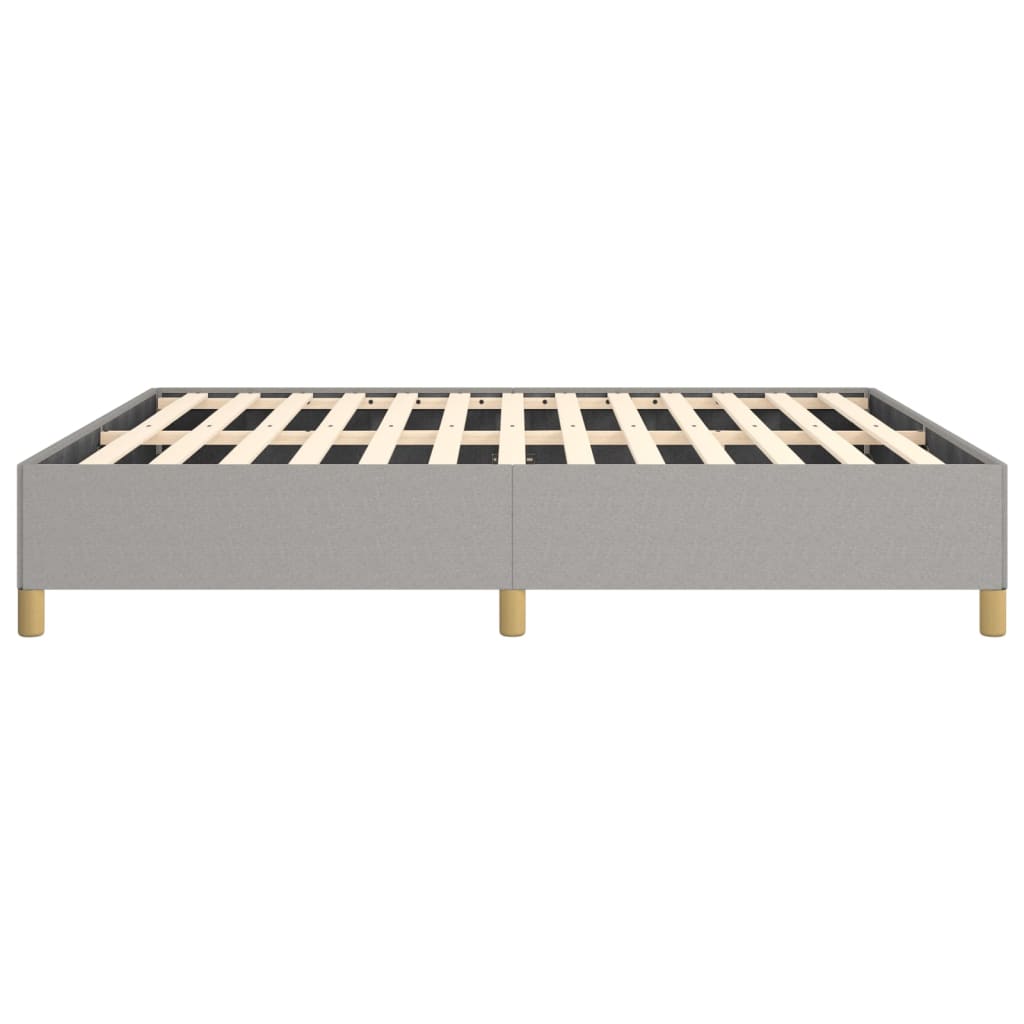 Grey upholstered platform bed frame with wooden slats