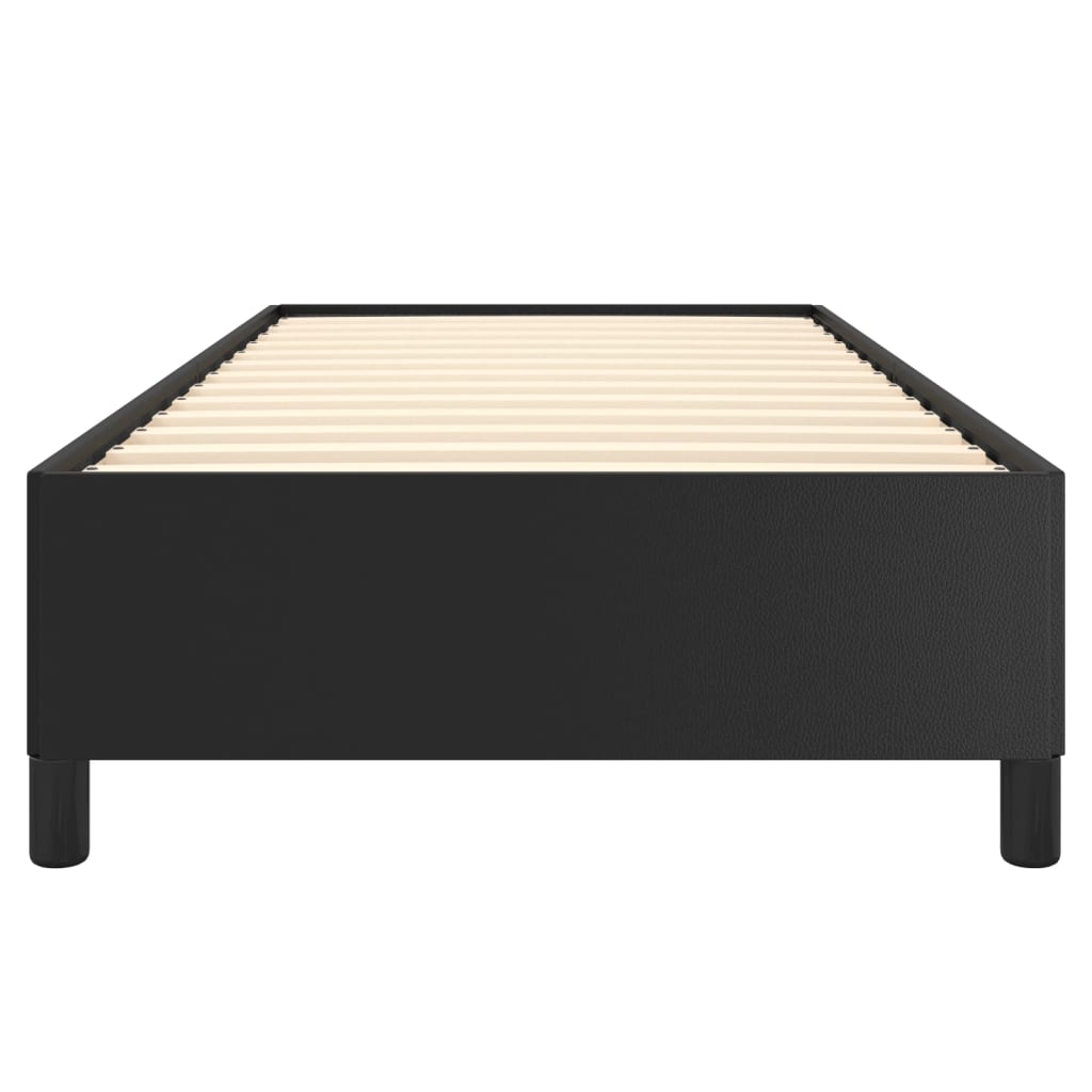 Black upholstered single bed frame with white mattress