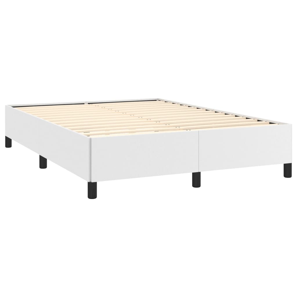 White upholstered queen bed frame with black metal legs in a minimalist bedroom