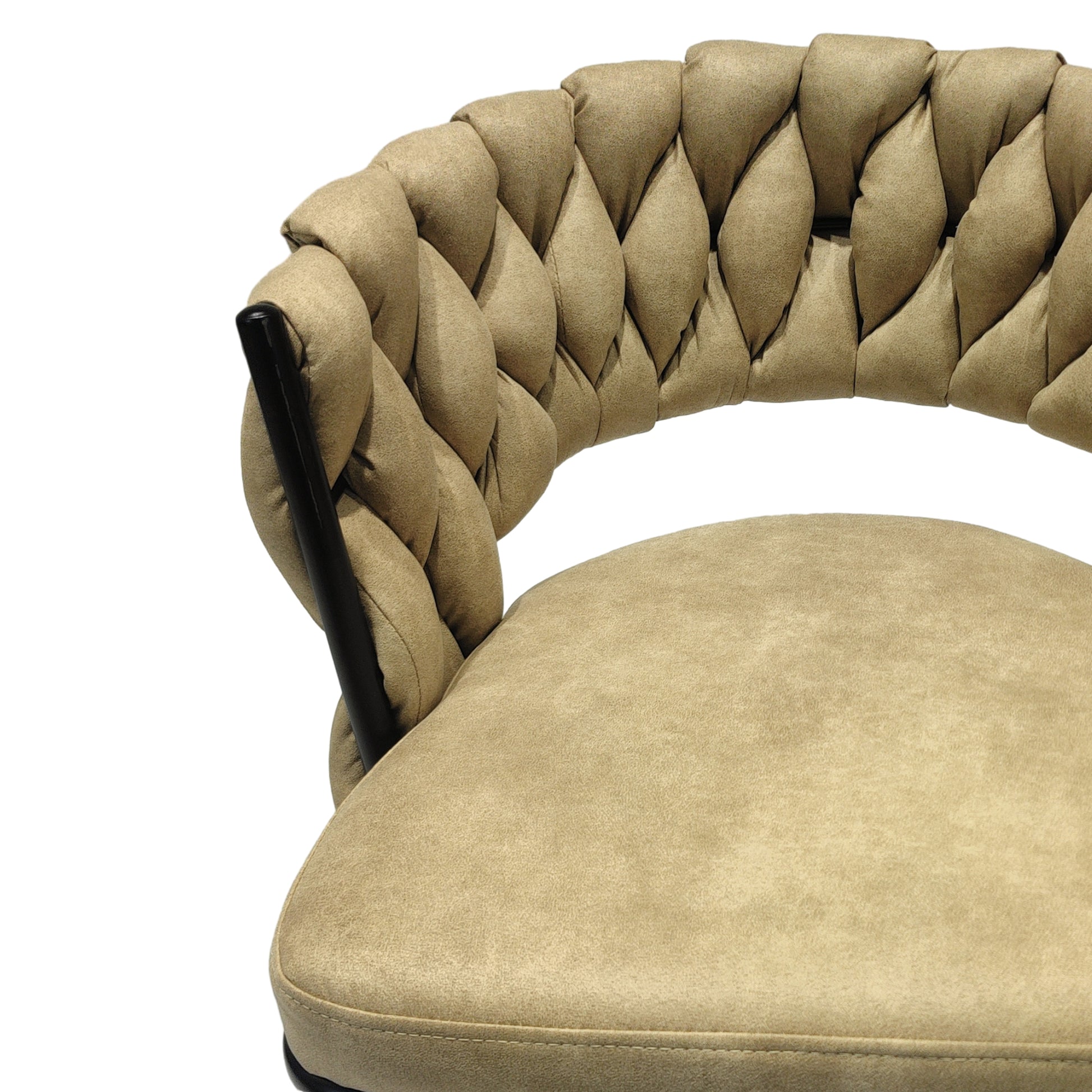 Closeup of tufted beige upholstered chair back with dark metal frame detail