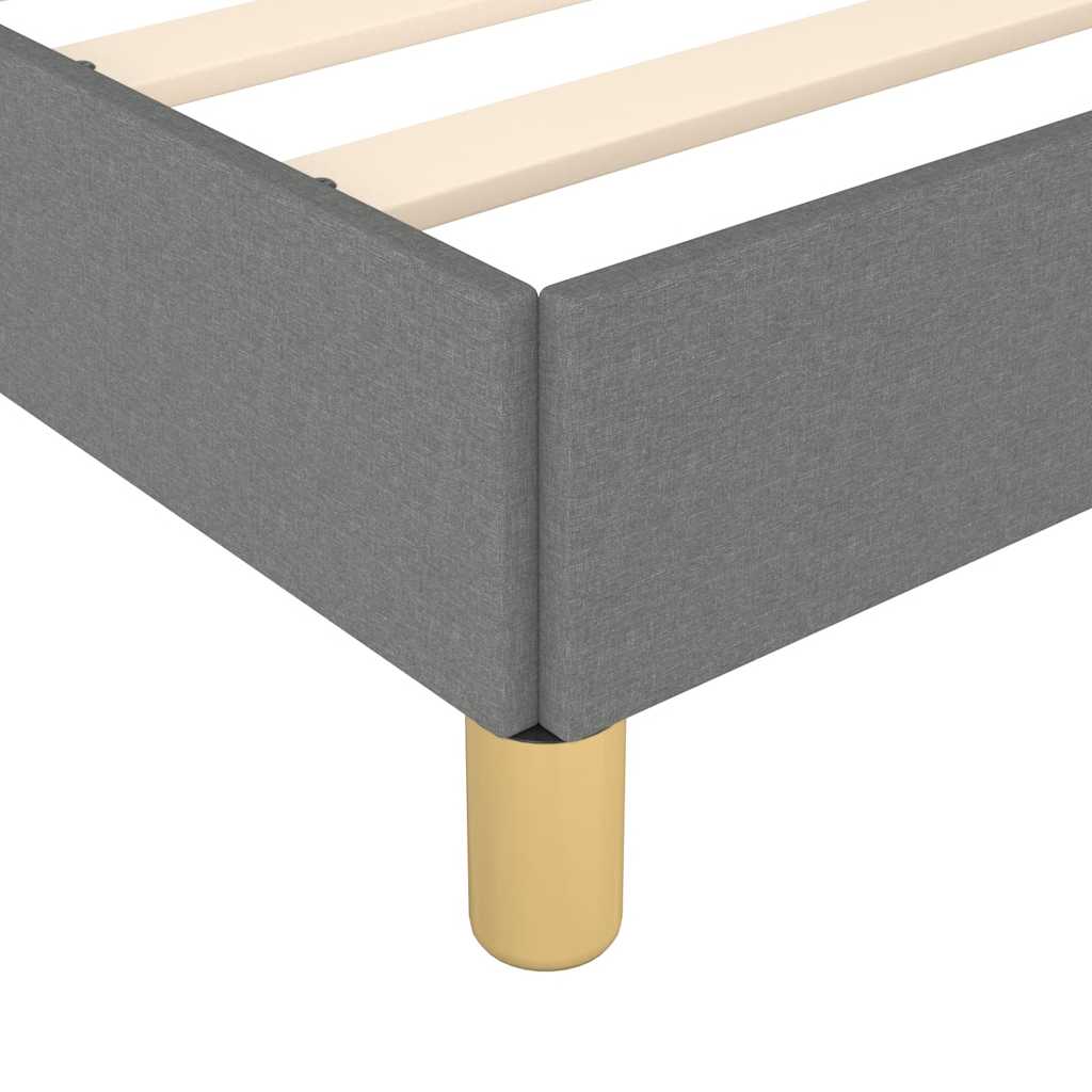 Dark gray upholstered bed frame with wooden slats and gold legs