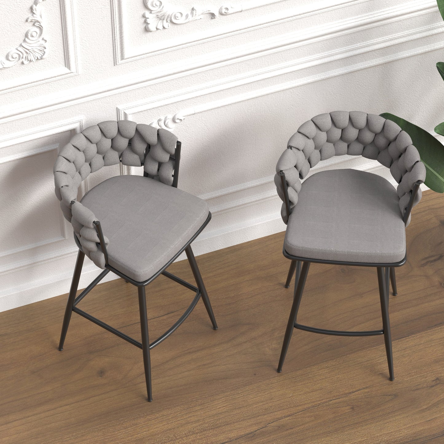 Grey upholstered bar stool with rounded back and black metal legs