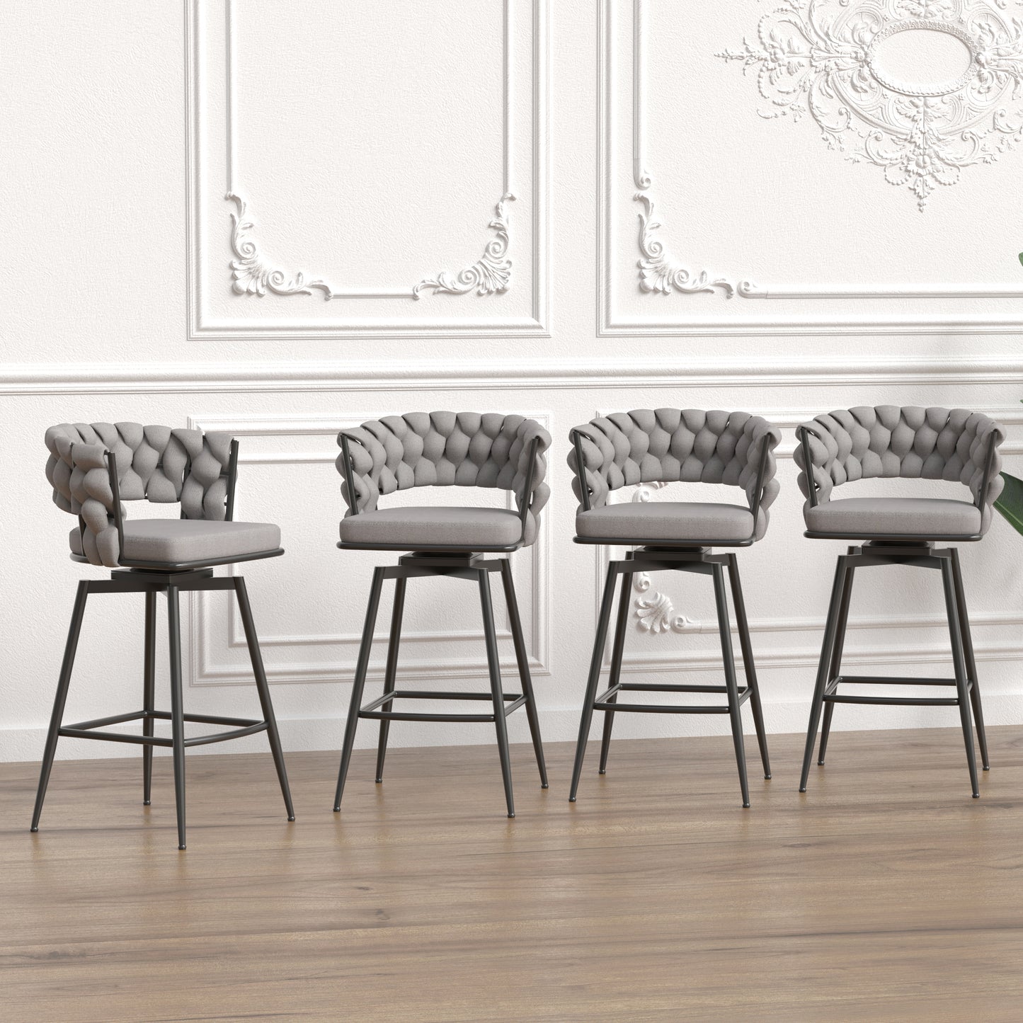 Four gray upholstered swivel bar stools with tufted backs and dark metal legs
