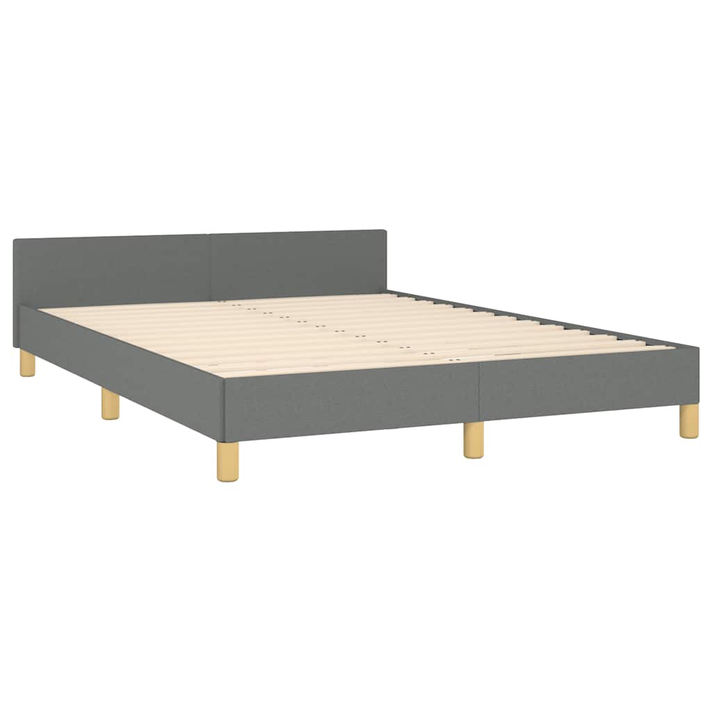 Modern grey upholstered platform bed frame with wooden legs and white bedding