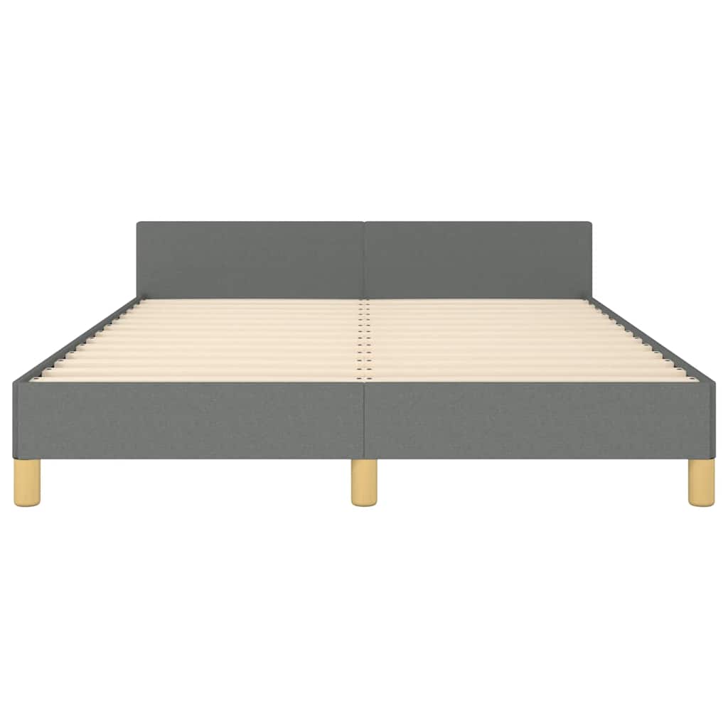 Grey fabric bed frame with white mattress and wooden legs