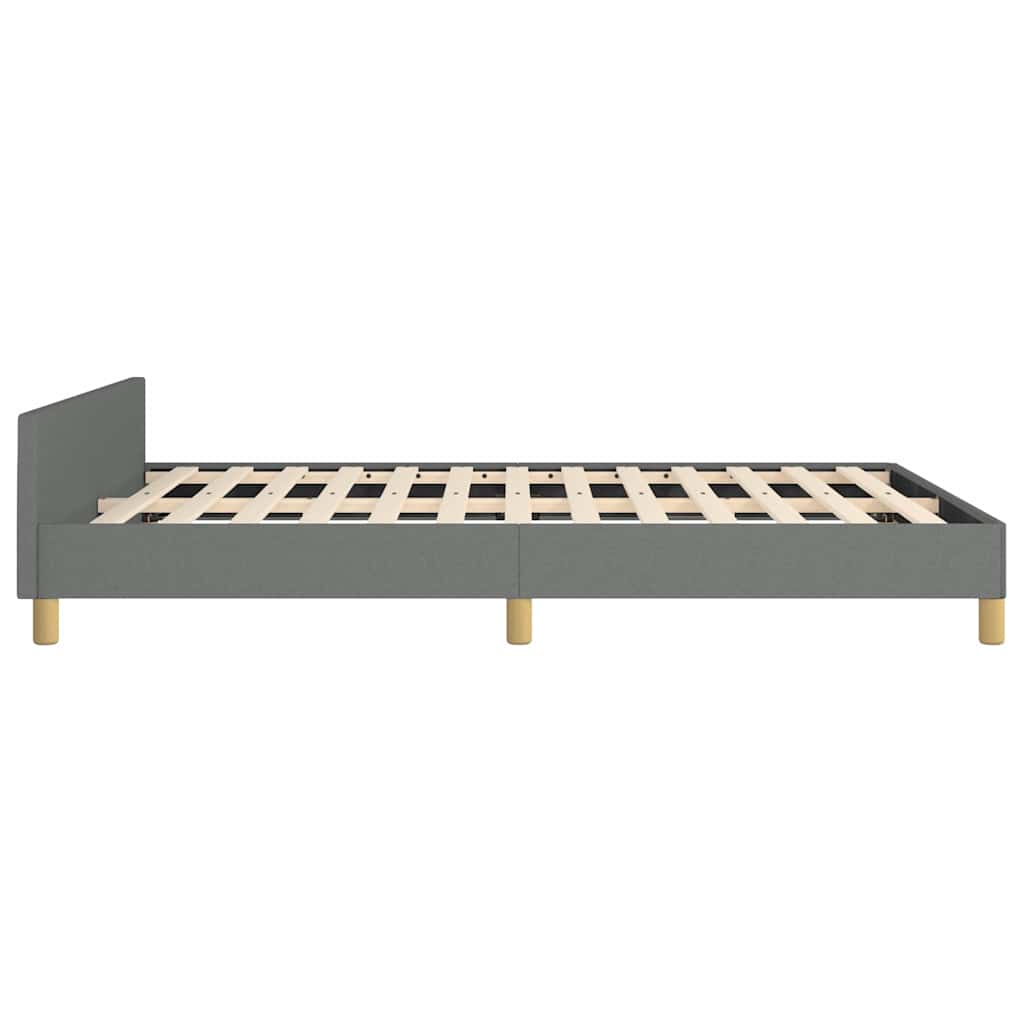 Grey fabric upholstered platform bed with wooden slats