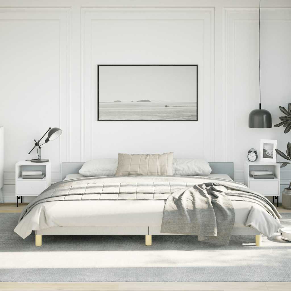 Modern gray upholstered queen bed frame with clean lines and minimal gold legs
