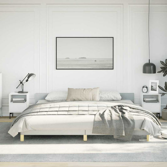 Modern gray upholstered queen bed frame with clean lines and minimal gold legs