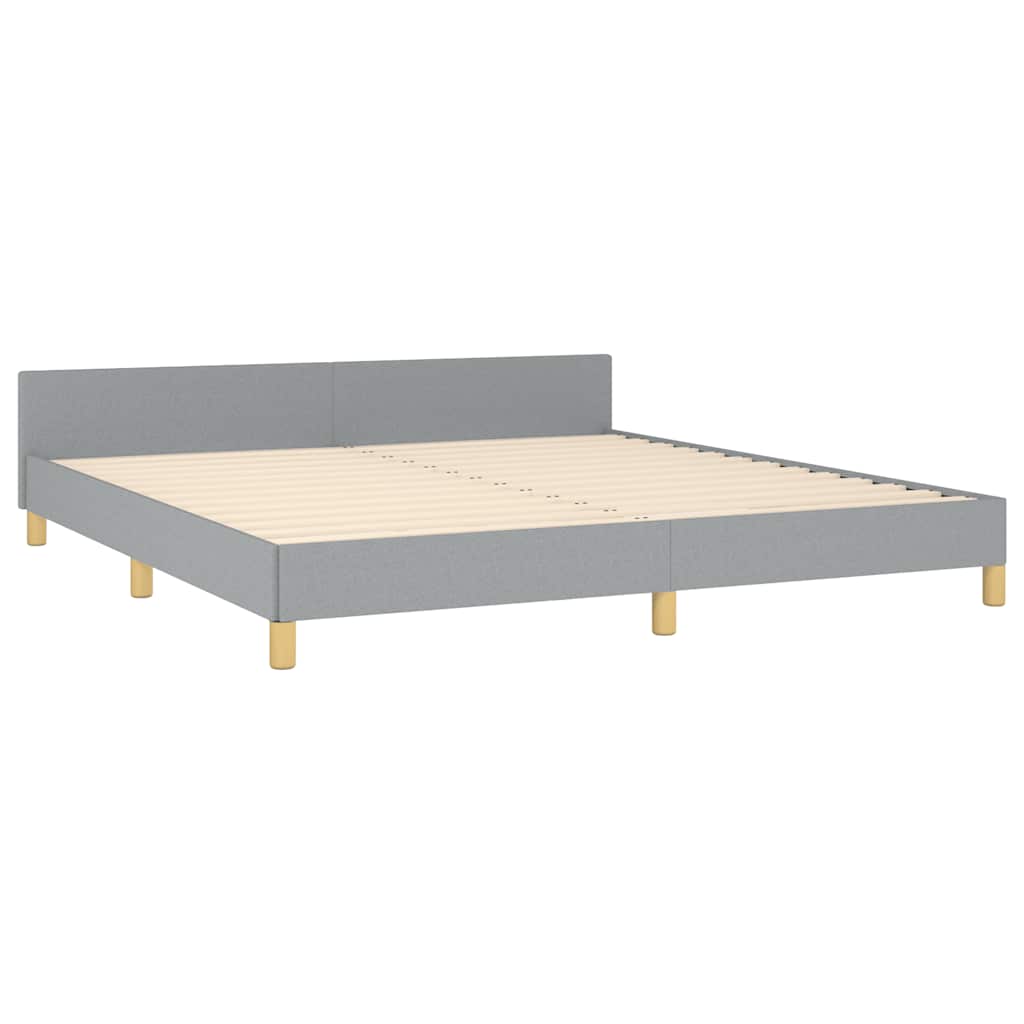 Modern grey upholstered platform bed frame with light wood legs