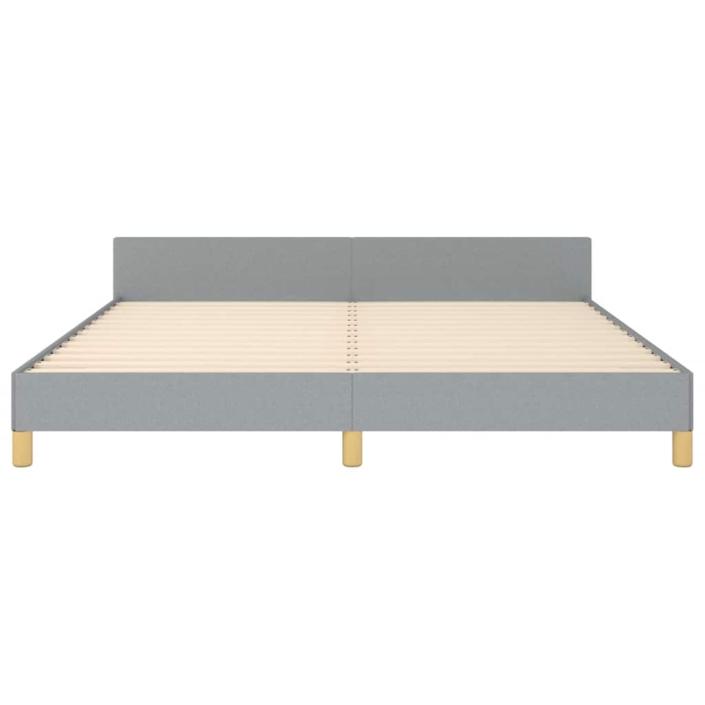 Light gray upholstered bed frame with wooden legs