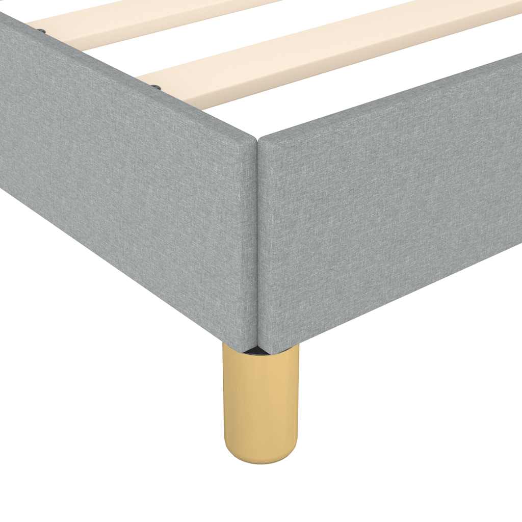 Modern grey upholstered bed frame with golden legs and wooden slats