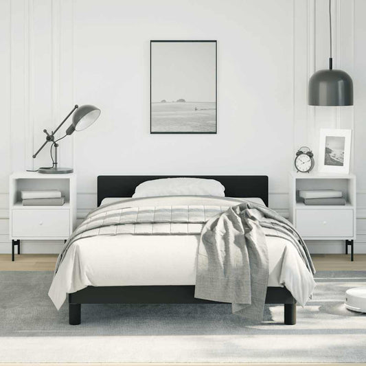 Modern black metal twin bed frame with white bedding
