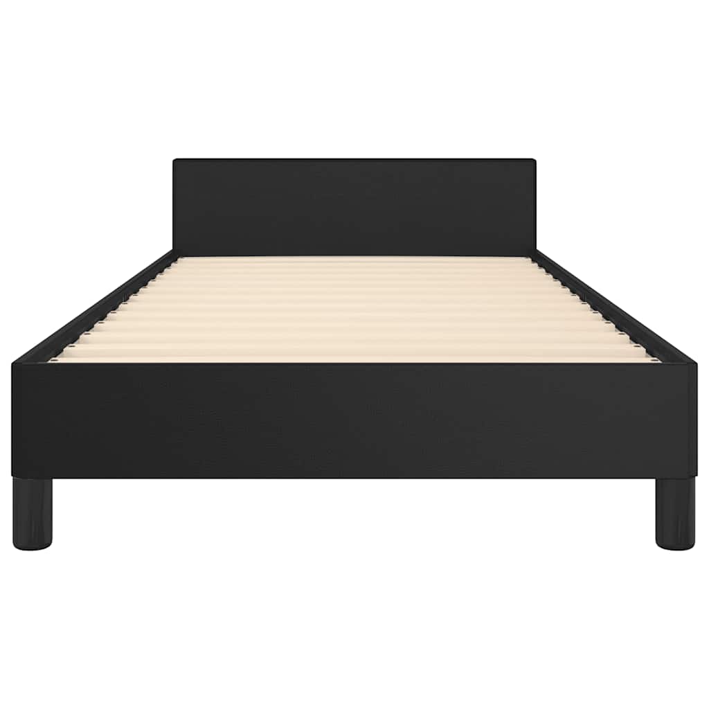 Black upholstered bed frame with white mattress