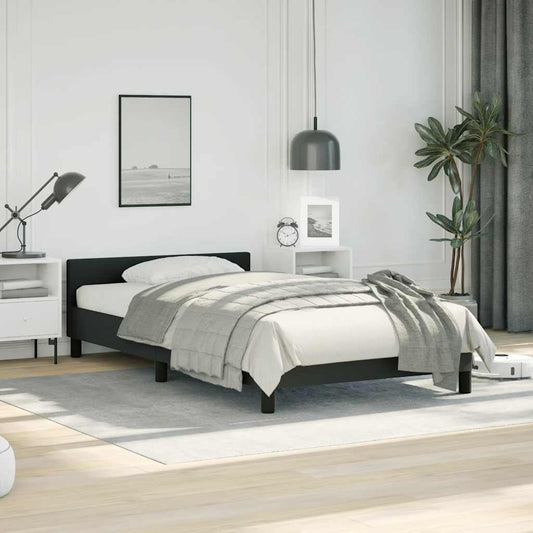 Black modern platform bed frame with white bedding and grey throw blanket