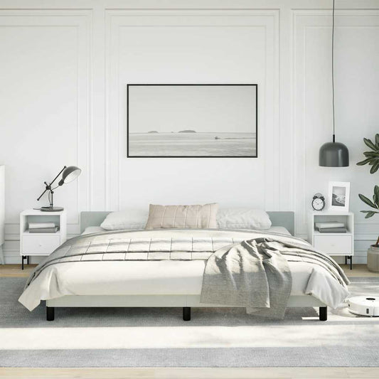 Minimalist platform bed frame in light gray fabric with black legs