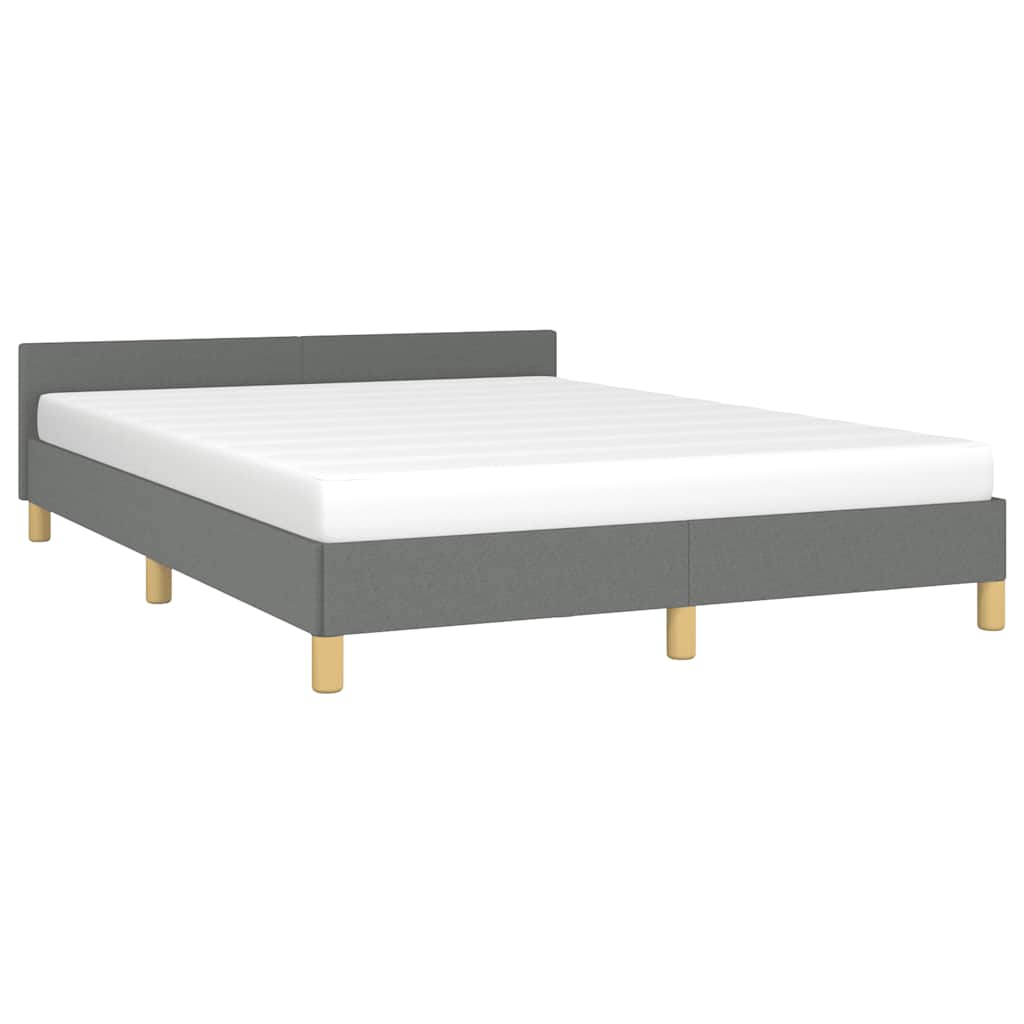 Gray upholstered platform bed frame with white mattress and wooden legs