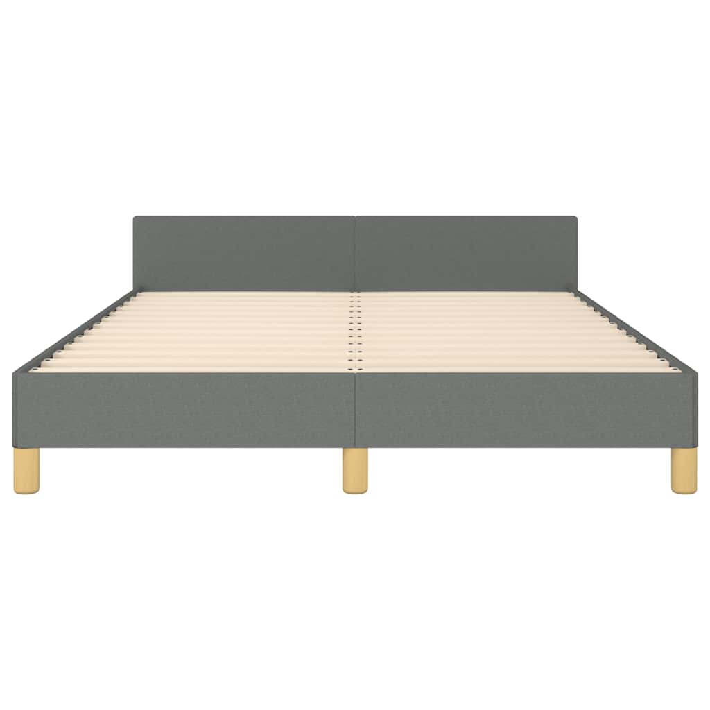 Grey fabric bed frame with white mattress and wooden legs