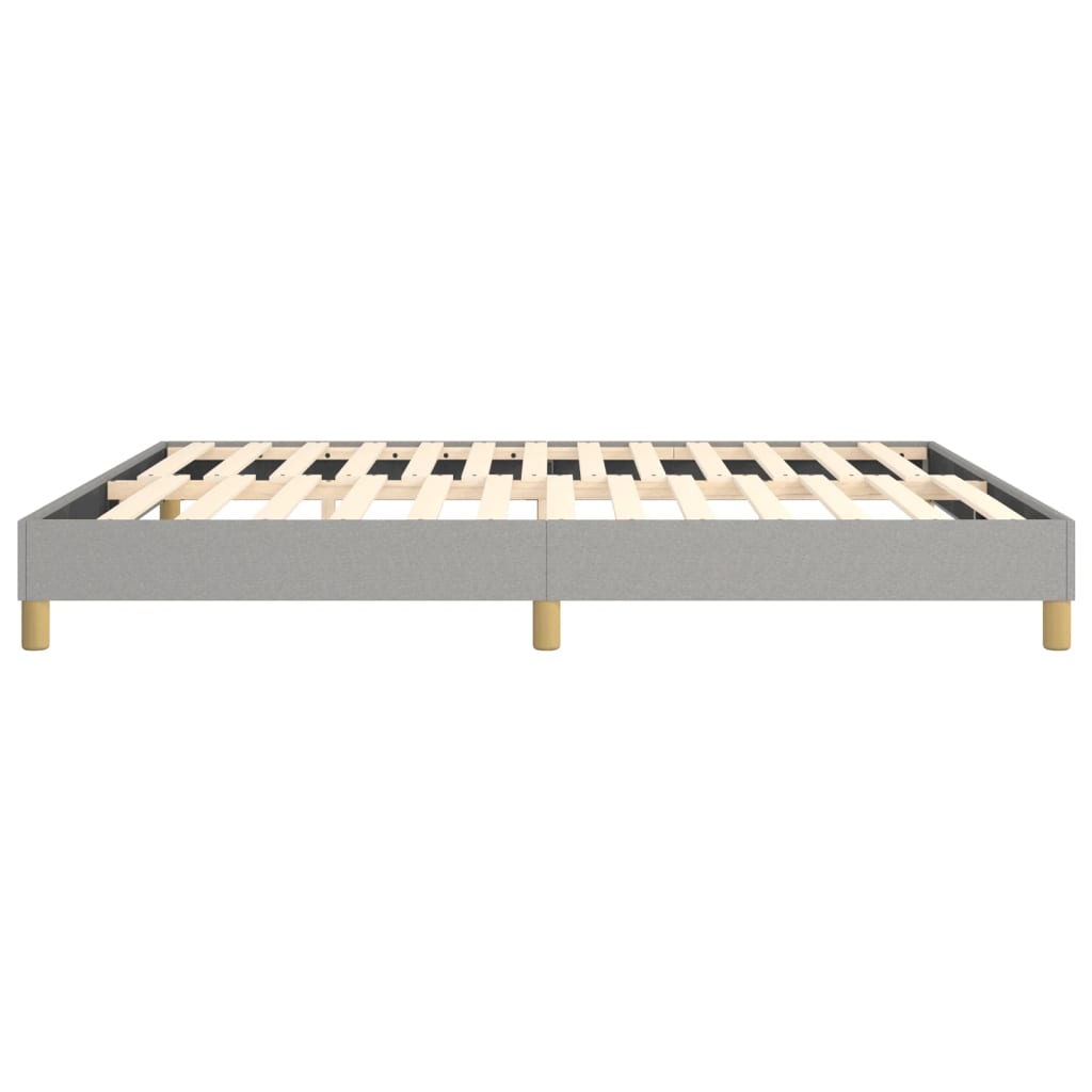 Grey upholstered platform bed frame with wooden slats and gold legs