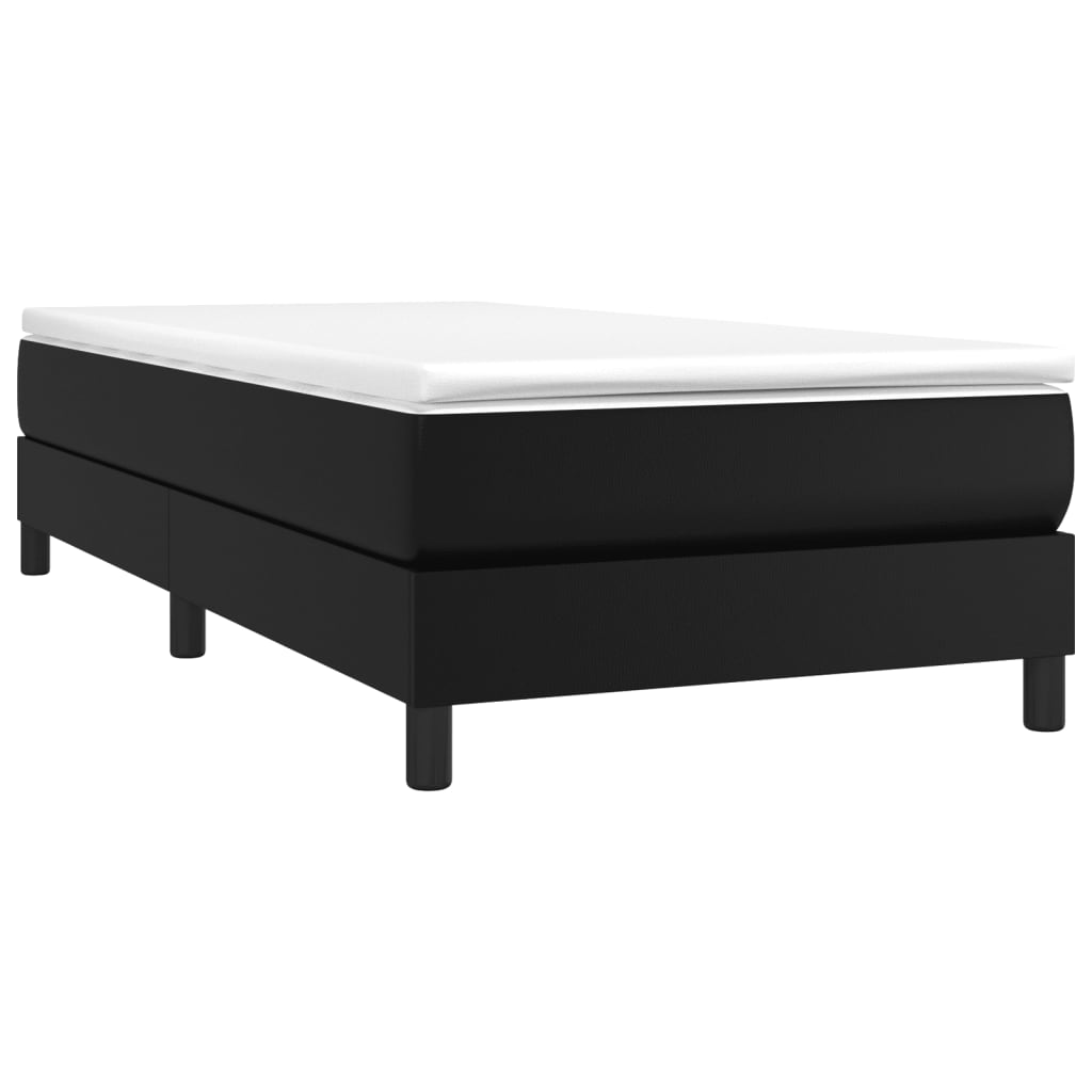 Black upholstered bed frame with a white mattress on top featuring four black cylindrical legs