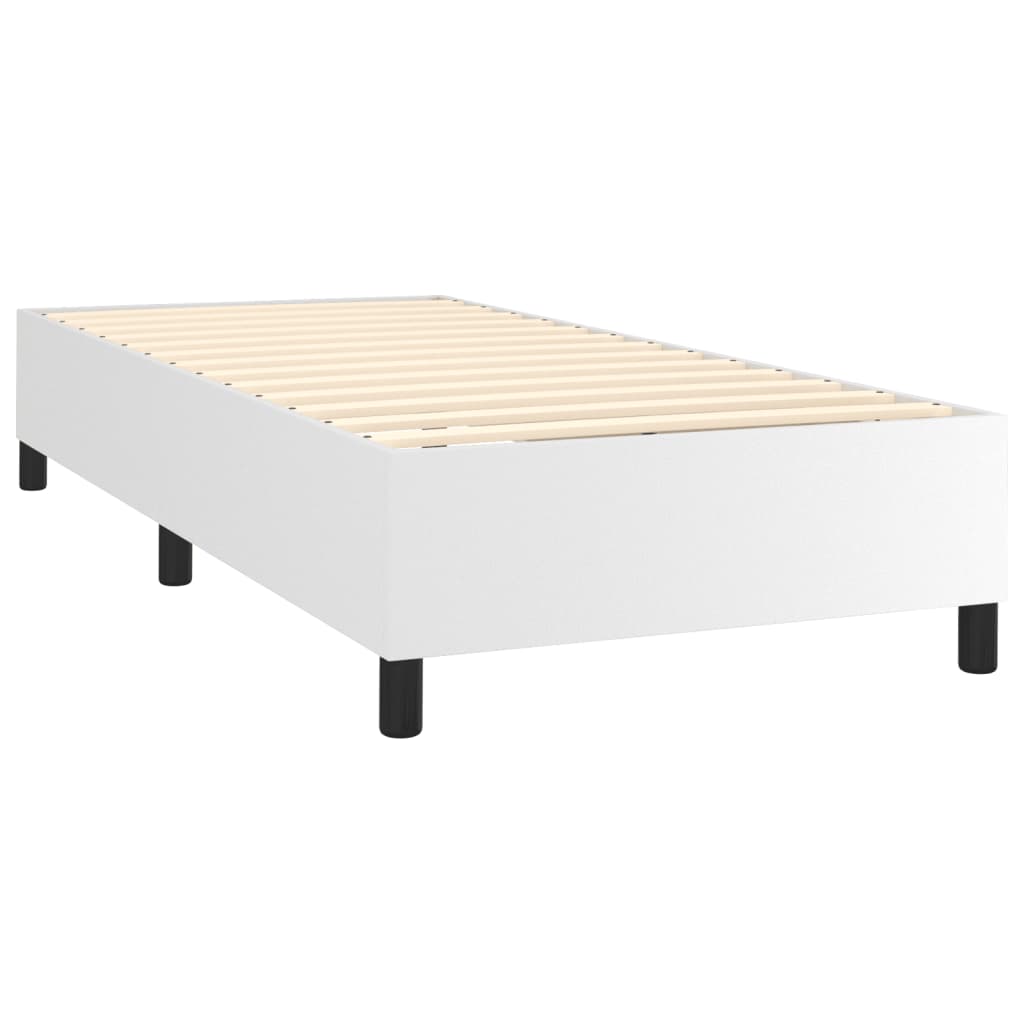 White box spring mattress with black legs