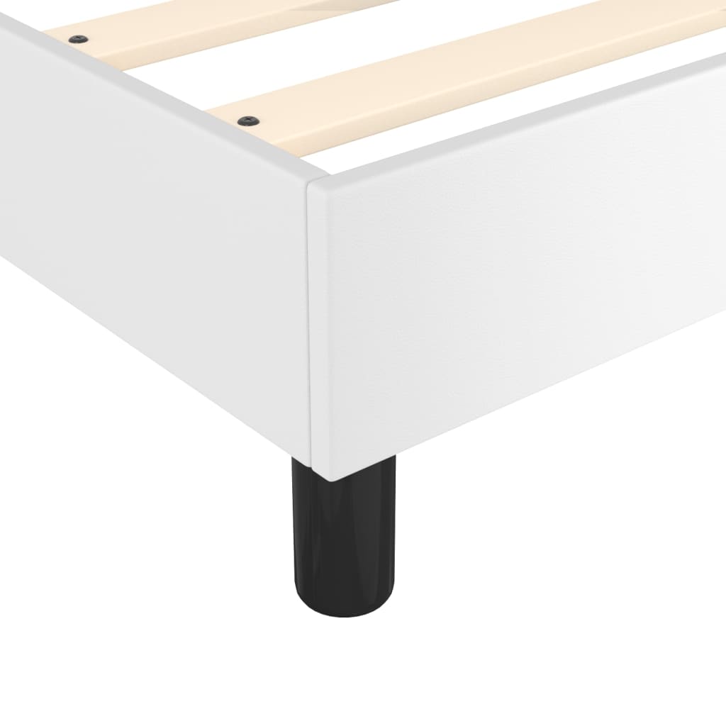 White modern platform bed frame with wooden slats and black legs