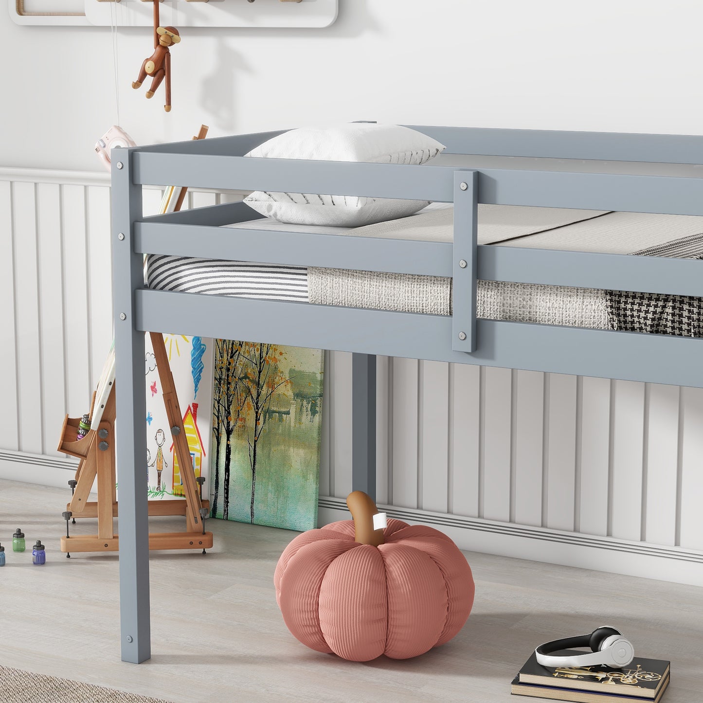 Gray wooden twin loft bed with white pillows and striped bedding