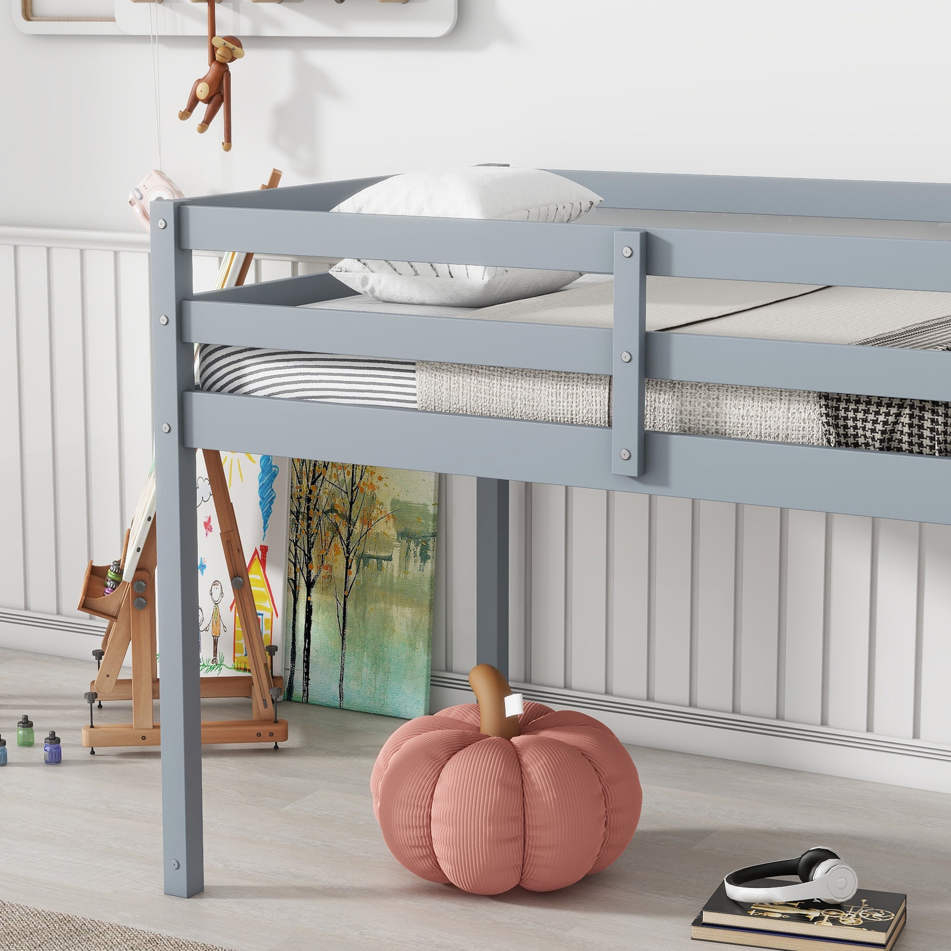 Gray wooden twin loft bed with white pillows and striped bedding