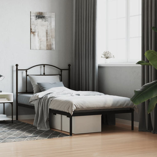 Black metal twin bed frame with ornate headboard and footboard