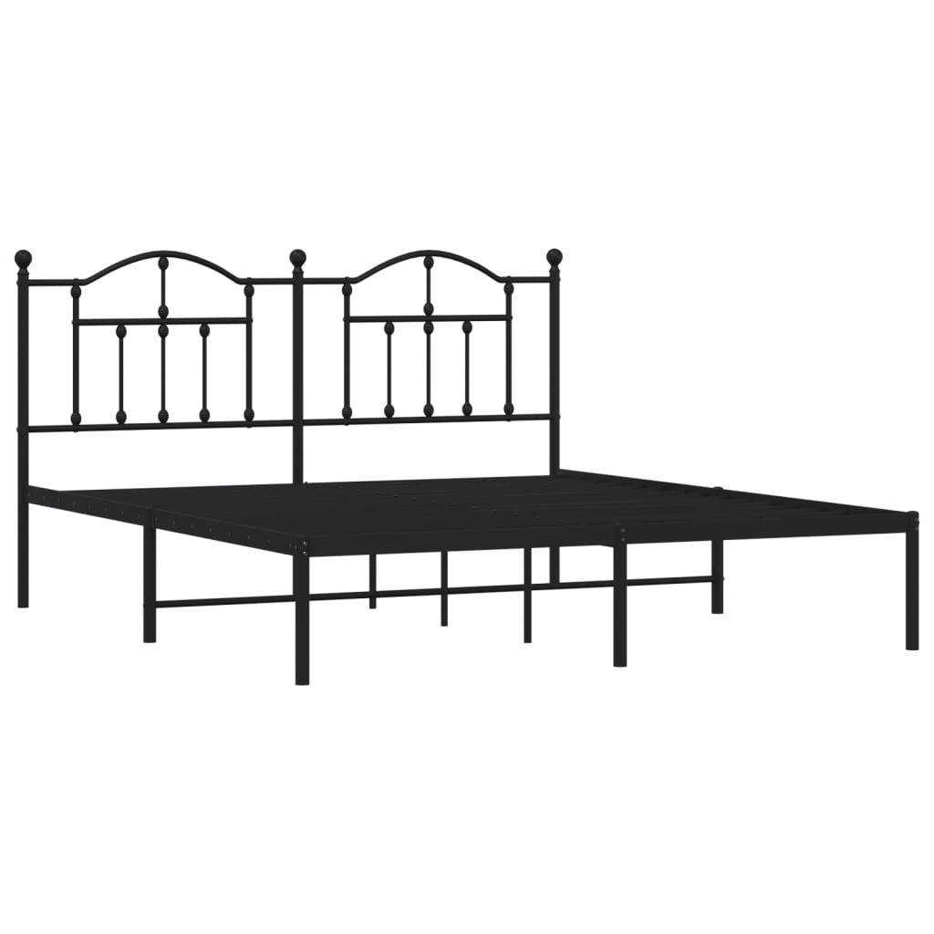 Black metal twin bed frame with ornate headboard and white mattress