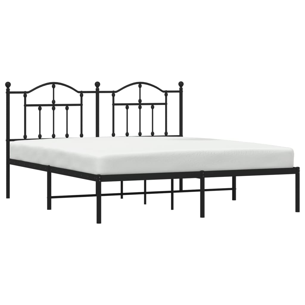Black metal bed frame with ornate headboard