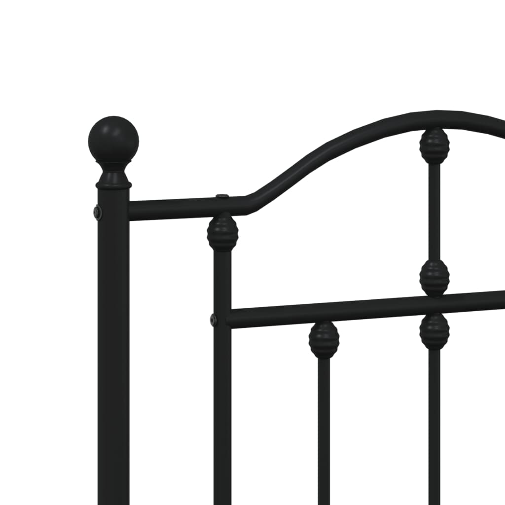 Black wrought iron bed frame with ornate headboard detail