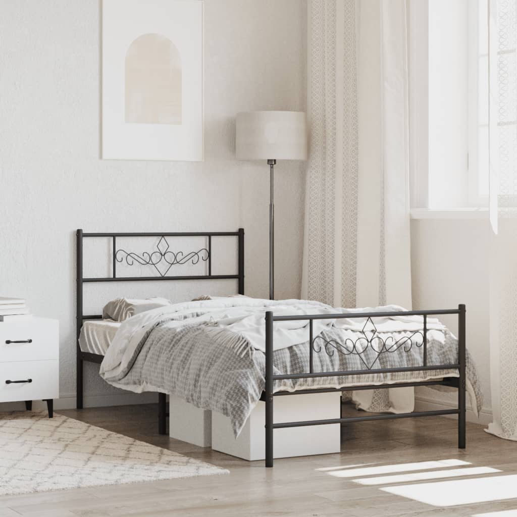 Black metal bed frame with decorative headboard and footboard