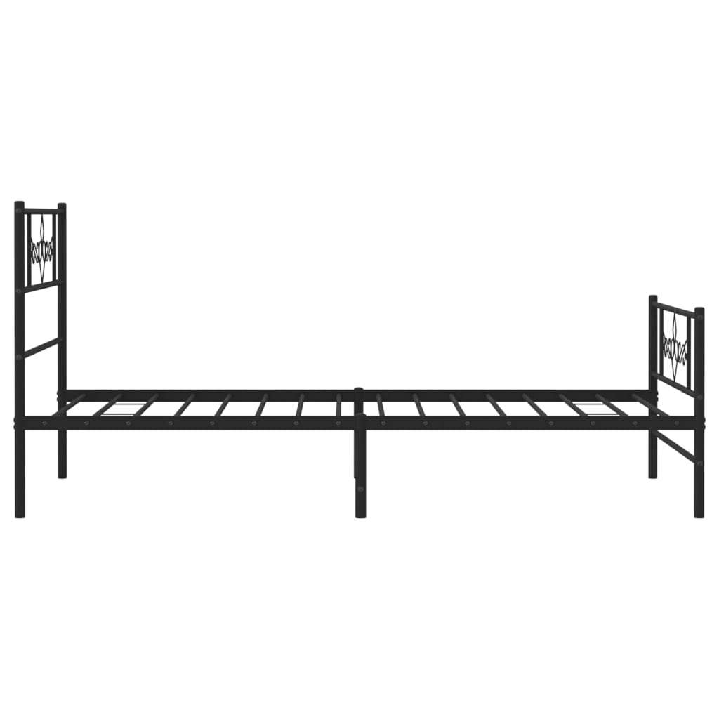 Black metal bed frame with ornate scrollwork headboard and footboard