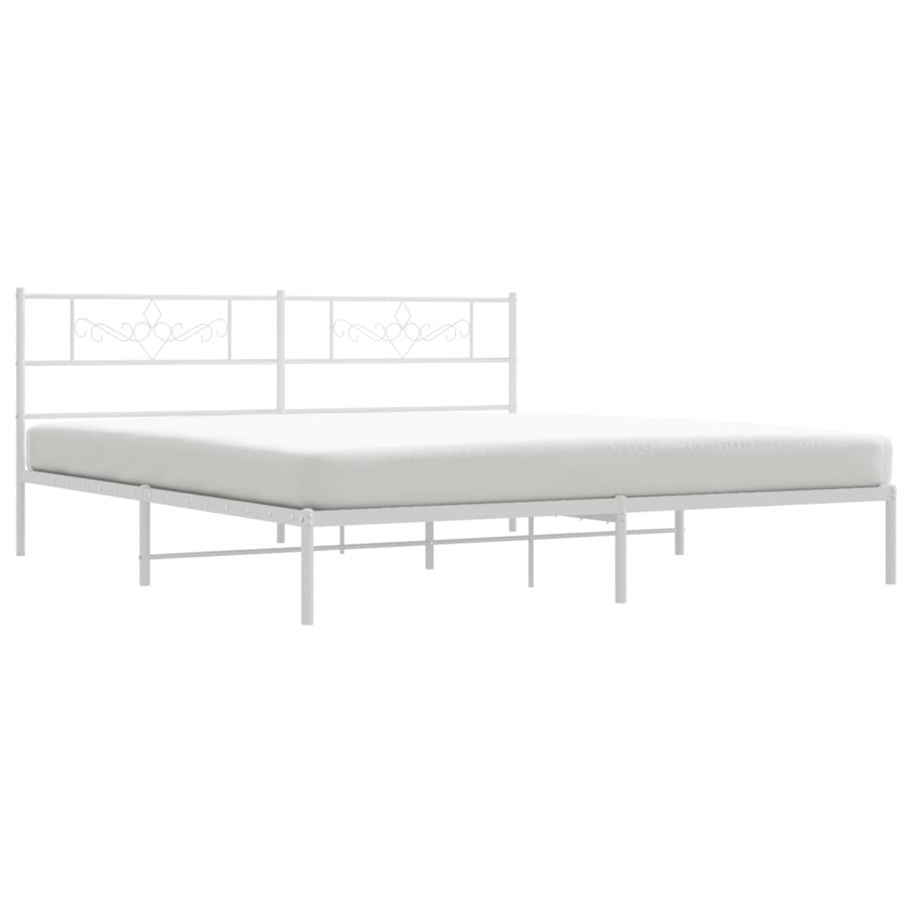 White metal bed frame with ornate headboard detail