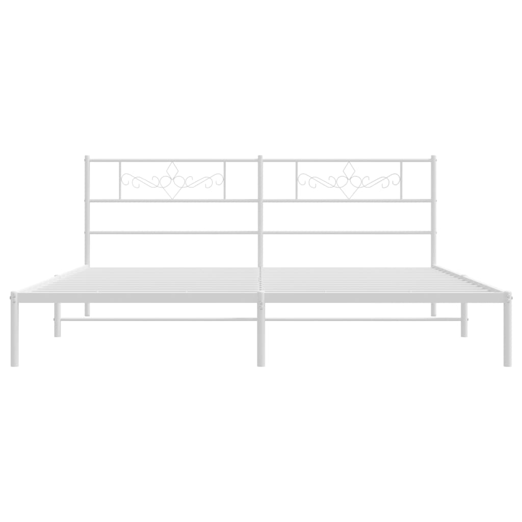 White metal bed frame with ornate headboard detail