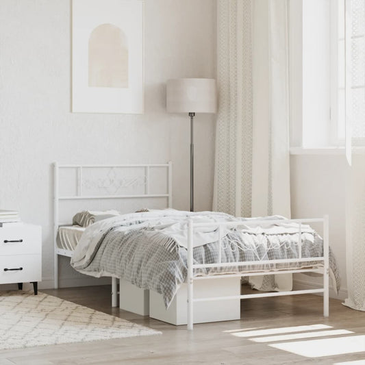 White metal twin bed frame with decorative headboard and footboard