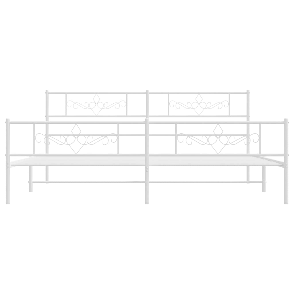 White metal bed frame with decorative scrollwork headboard and footboard